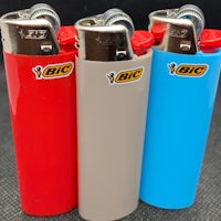 three lighters with different colors and logos